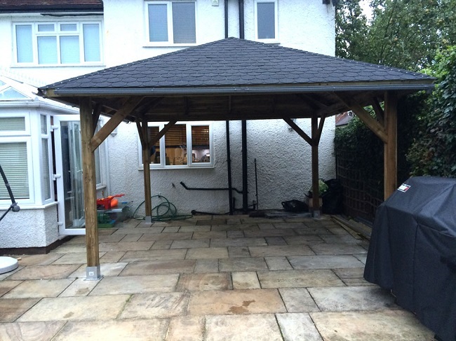 Classico gazebo installed close to a house wall