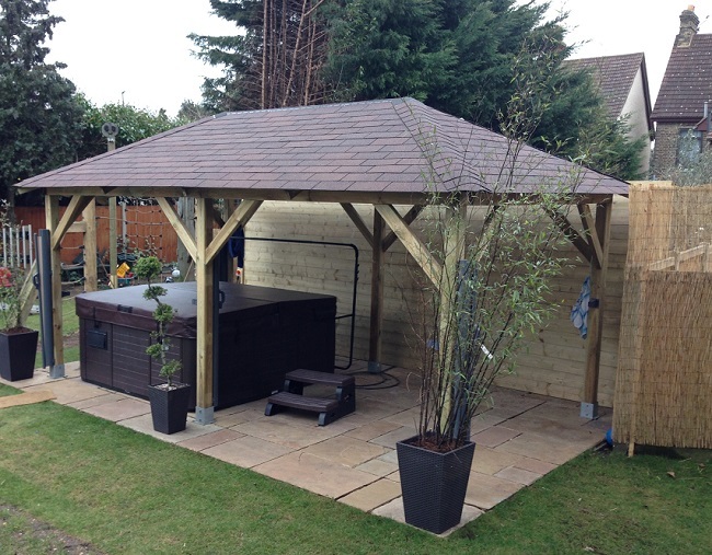 Superior wooden gazebo used to cover a patio and hot tub